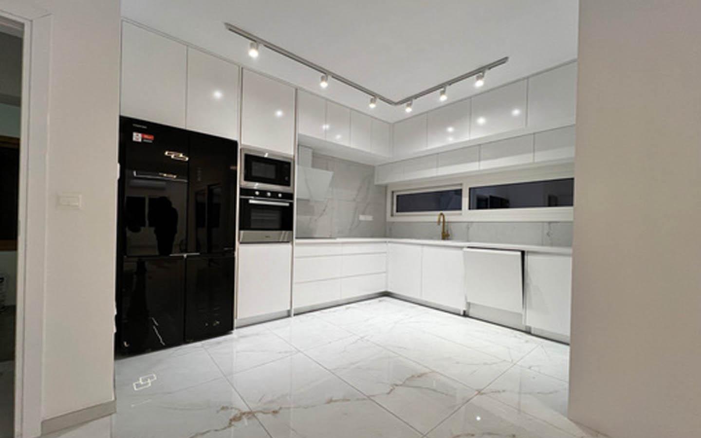 Two-Bedroom Apartment with Pristine White Finish and Premium Black Appliances — Limassol