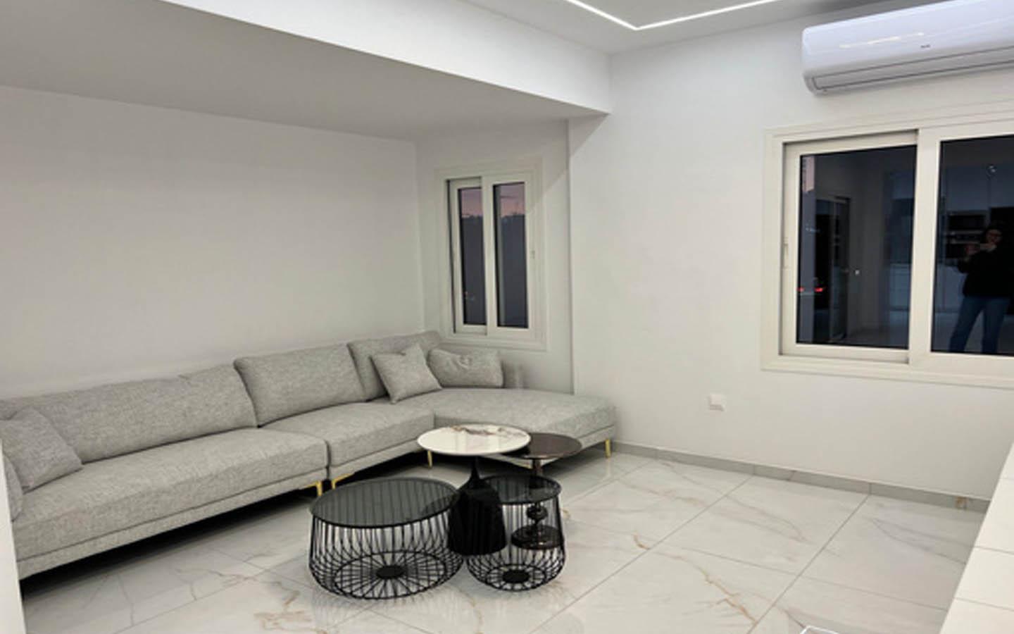 Two-Bedroom Apartment with Pristine White Finish and Premium Black Appliances — photo 3